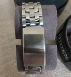 Military style watch bracelet and clasp close-up with steel link band
