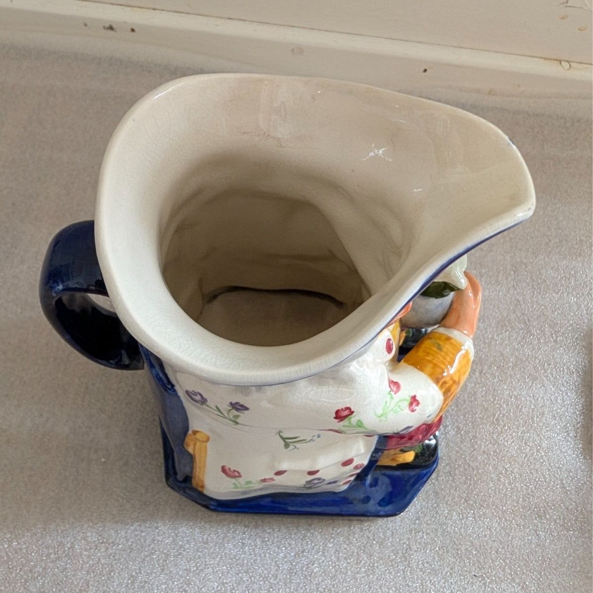 Spode Toby jug character pitcher, top rim view with handle and floral decoration