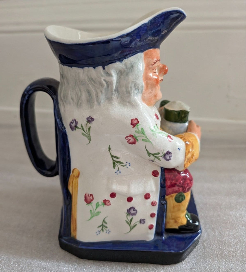 Spode Toby jug character pitcher, front angle with floral vines and figurine holding jug