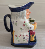 Spode Toby jug character pitcher, front angle with floral vines and figurine holding jug