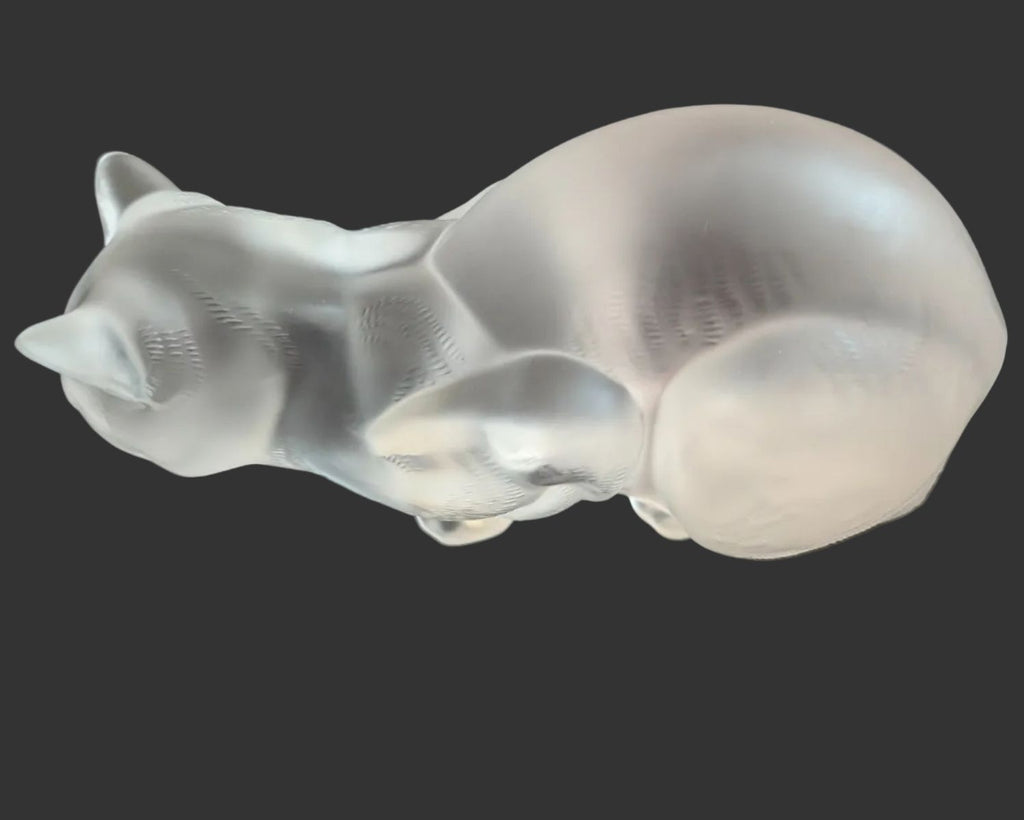 Frosted crystal cat sculpture, crouching pose with textured fur detail, side view