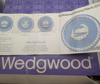 Wedgwood Christmas plate in purple retail box with blue plate image