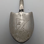 Shovel-shaped collector spoon with engraved Minnesota map and text on reverse side