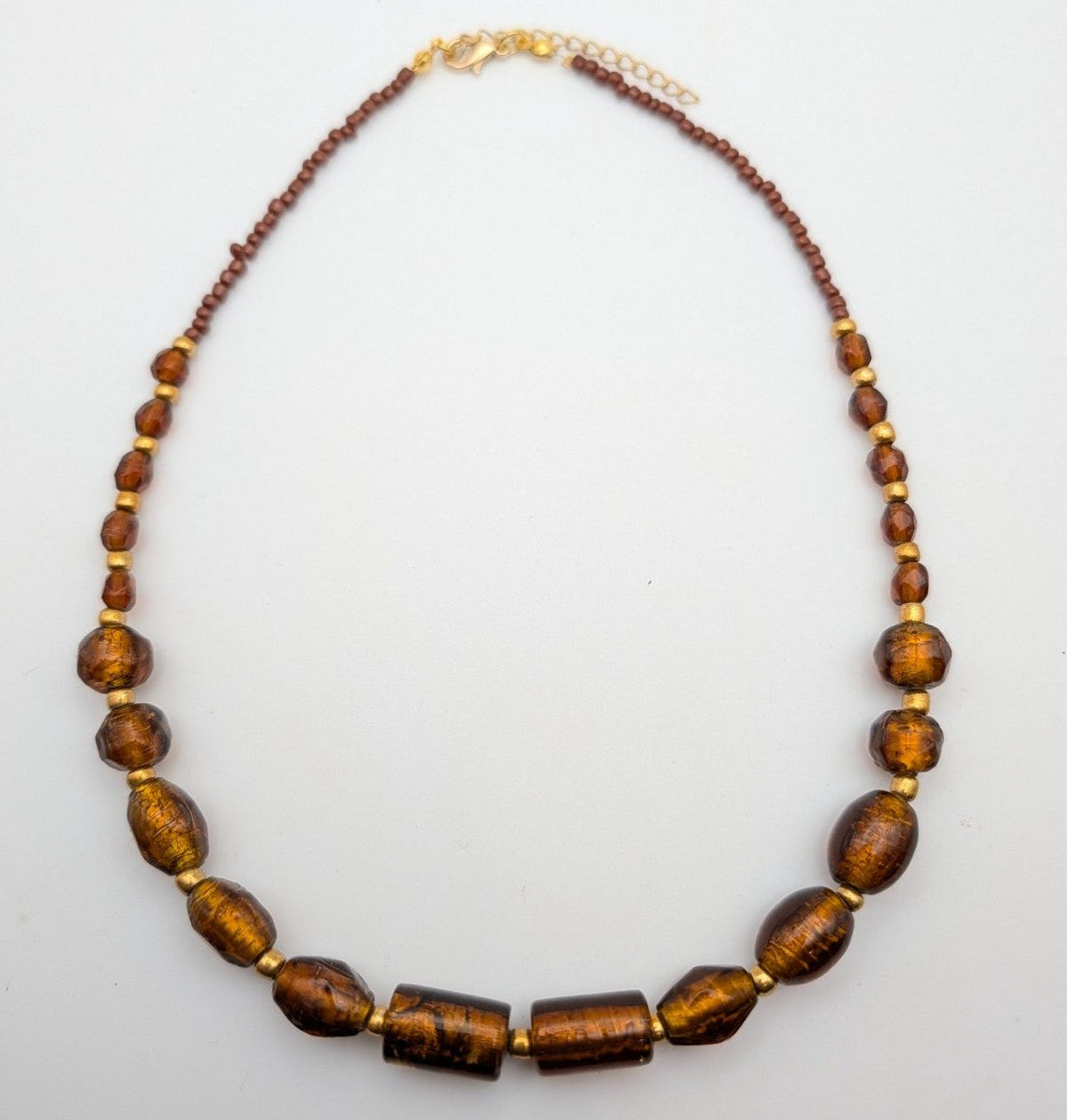 Amber glass bead necklace with dark brown and amber barrel beads, gold-tone clasp