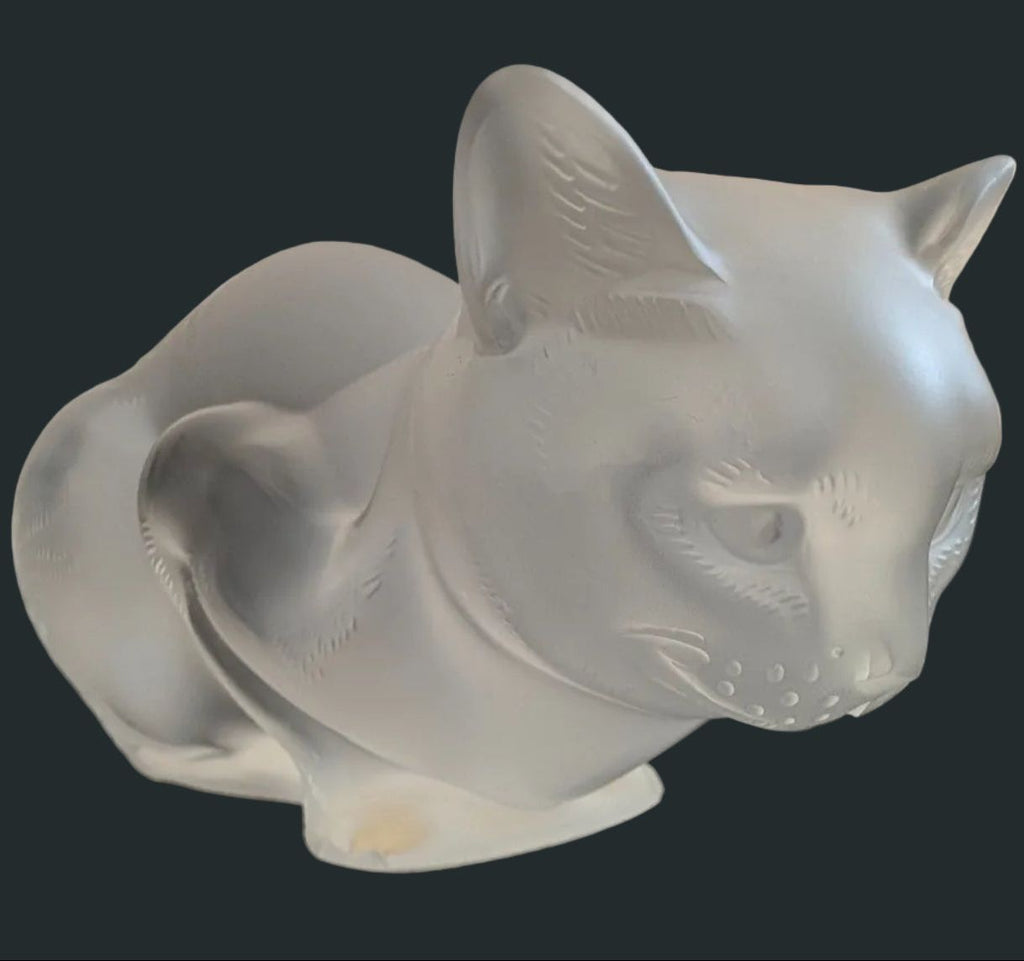 Frosted crystal cat sculpture, crouching pose with head turned left, textured face