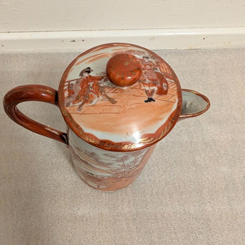 Hand-painted porcelain coffee pot with lid, orange knob, village scene on lid