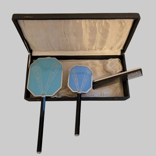 Blue octagonal dressing mirror and comb set in open box