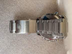 Stainless steel watch case underside with bracelet links and metal clasp detail