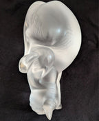 Frosted crystal cat sculpture, three-quarter view with curled body and tail