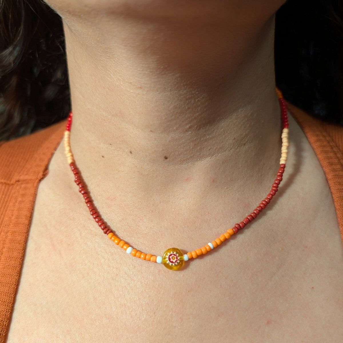 Orange-red beaded flower choker necklace with millefiori centerpiece