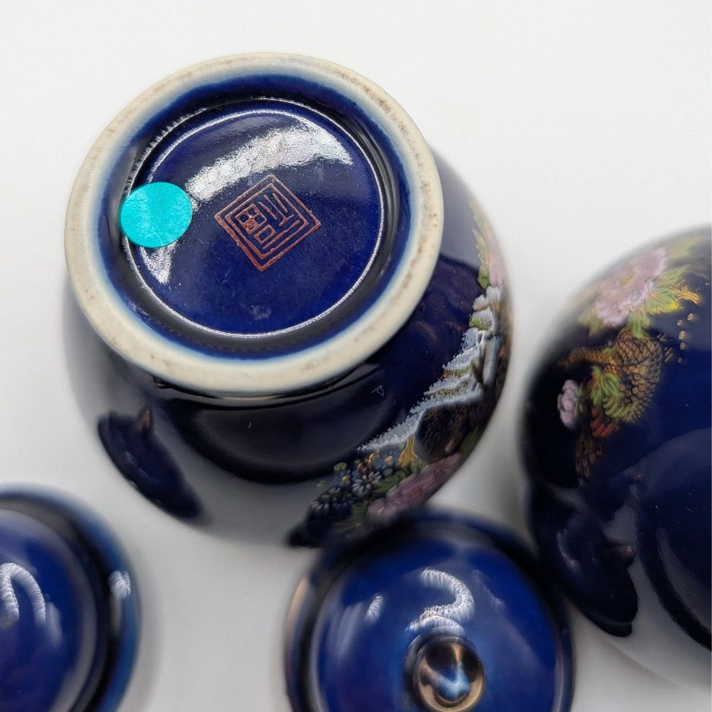 Cobalt blue ceramic ginger jar bottom with white rim and gold mark