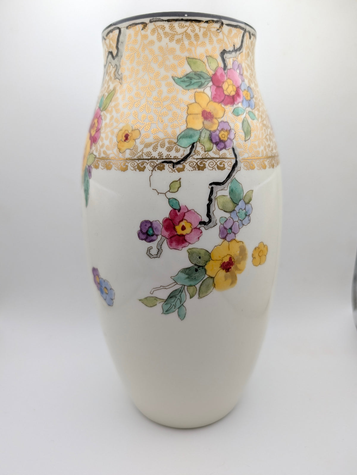 Reverse view of Royal Doulton floral vase with colourful flowers