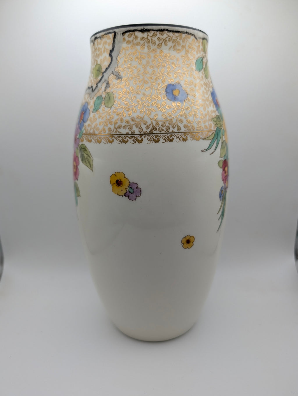 Side view of Royal Doulton England floral decorative vase