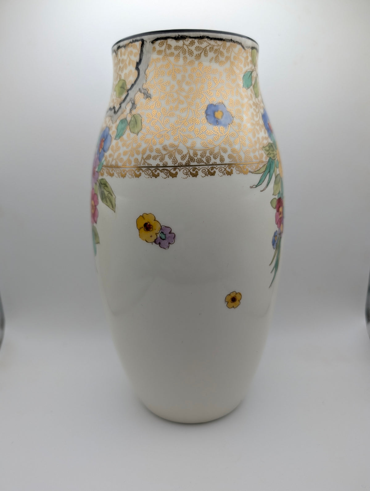 Side view of Royal Doulton England floral decorative vase