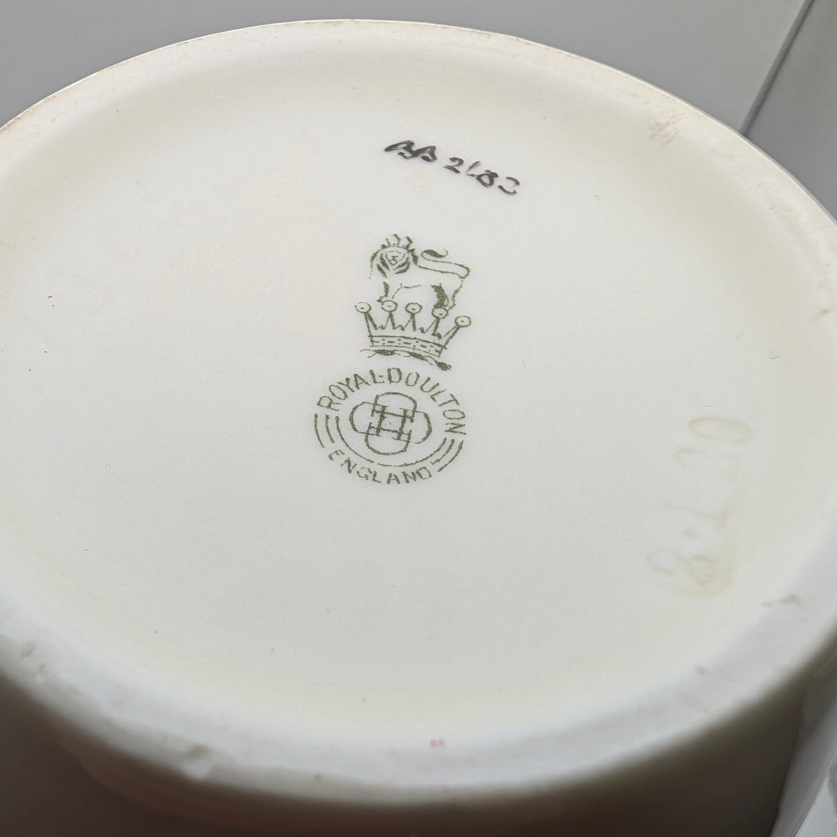 Royal Doulton England backstamp and indistinct painted reference on vase base