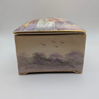 Side view of Crown Devon musical box with countryside and birds