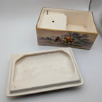 Underside of removable ceramic lid and interior of Crown Devon music box